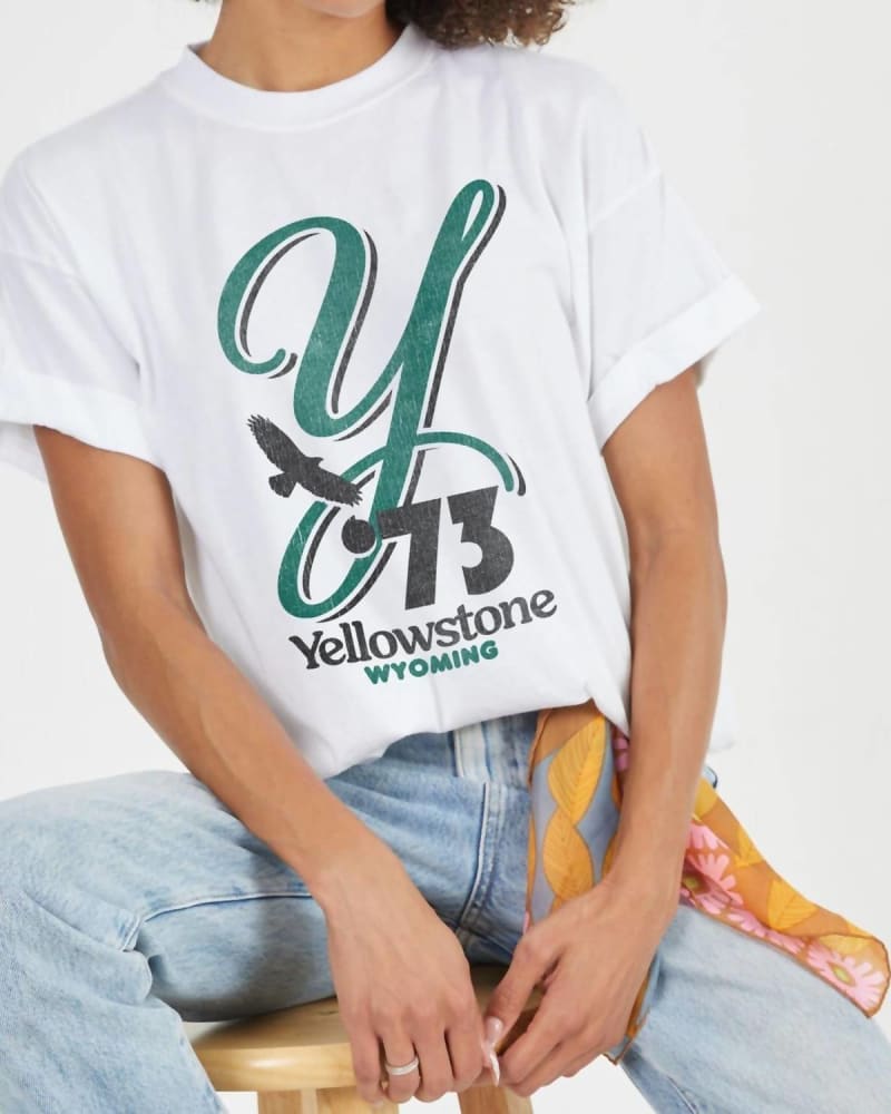Front of a model wearing a size Large Yellowstone Graphic Tee in White in White by PROJECT SOCIAL T. | dia_product_style_image_id:341599